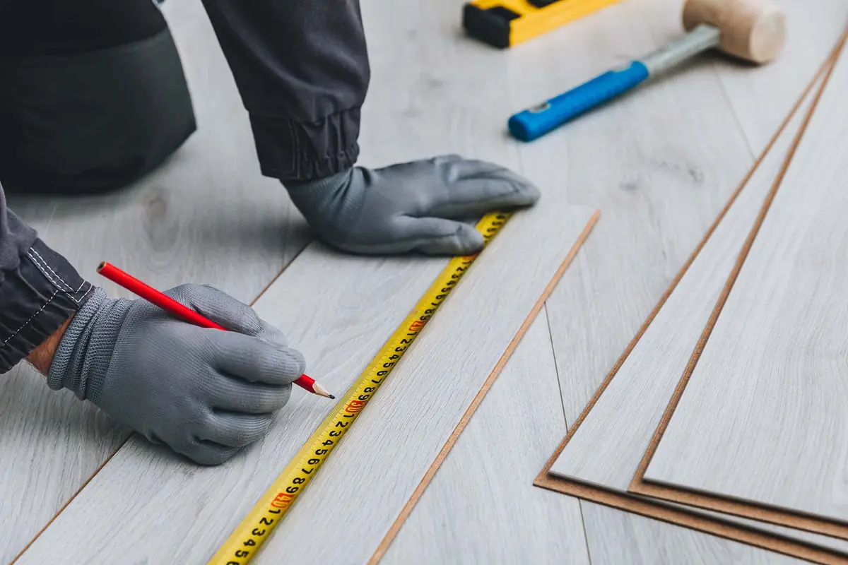 Measuring up a floor before fitting underfloor heating
