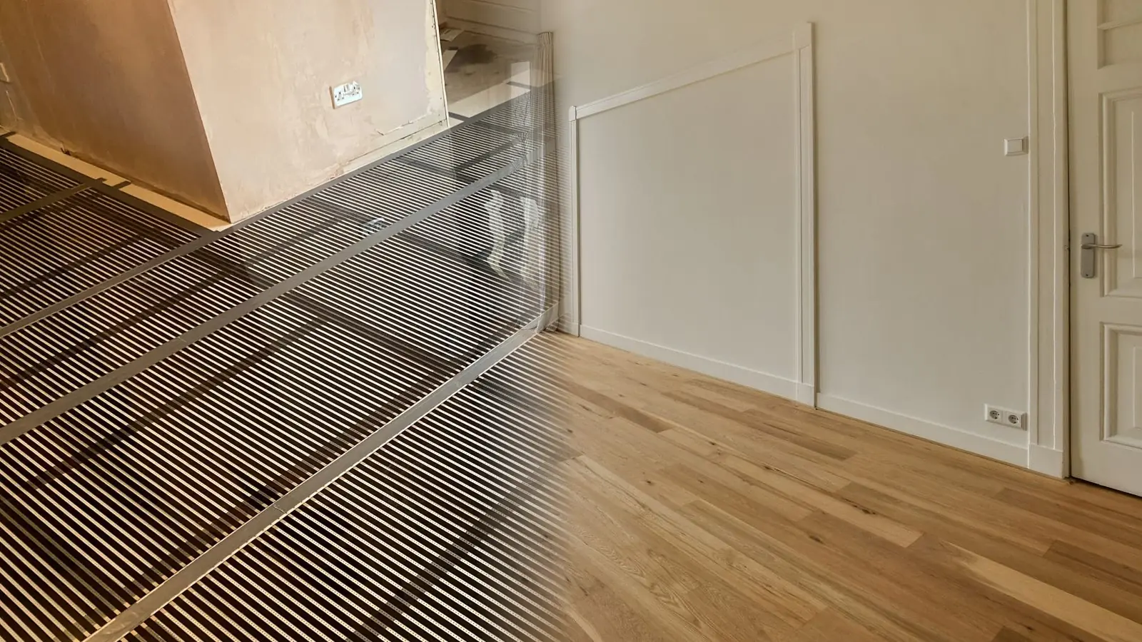 Carbon film laid beside finished oak boards